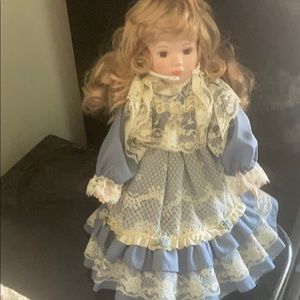 Porcelain doll in Blue dress